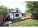 Newly renovated home featuring a charming backyard and a wooden deck perfect for outdoor relaxation at 722 E Minnesota St, Indianapolis, IN 46203