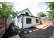 Landscaped backyard shows deck and walking stones at 722 E Minnesota St, Indianapolis, IN 46203
