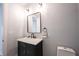 Stylish half bathroom with a modern mirror, elegant vanity, and a sleek black faucet at 722 E Minnesota St, Indianapolis, IN 46203