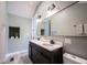 Bright bathroom offers double sink vanity, large mirror, and recessed shelving at 722 E Minnesota St, Indianapolis, IN 46203