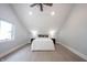 Charming bedroom with a sloped ceiling, natural light, and minimalist design, offering a peaceful atmosphere at 722 E Minnesota St, Indianapolis, IN 46203