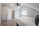 Bright bedroom boasts vaulted ceiling, ceiling fan, hardwood floors and closet space at 722 E Minnesota St, Indianapolis, IN 46203