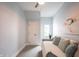 Bright bedroom with daybed, soft textures, ceiling fan, and a relaxing atmosphere at 722 E Minnesota St, Indianapolis, IN 46203