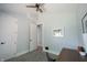 Bright bedroom with a ceiling fan, neutral walls, and an open doorway at 722 E Minnesota St, Indianapolis, IN 46203