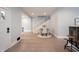 Stylish entryway featuring hardwood floors that lead to a dining area and a staircase, creating a welcoming ambiance at 722 E Minnesota St, Indianapolis, IN 46203
