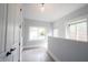 Bright entryway with white walls, wood floors and light from front window at 722 E Minnesota St, Indianapolis, IN 46203