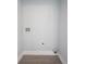 Empty laundry room with hookups, flooring and neutral paint at 722 E Minnesota St, Indianapolis, IN 46203