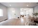 Bright and airy living room with hardwood floors, a view into an additional seating area, and recessed lighting at 722 E Minnesota St, Indianapolis, IN 46203