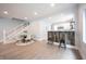 Inviting living space featuring an open floor plan, hardwood floors, with a kitchen bar at 722 E Minnesota St, Indianapolis, IN 46203