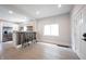 Open-concept living space with ample natural light, featuring a modern kitchen and hardwood floors throughout at 722 E Minnesota St, Indianapolis, IN 46203