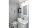 Well-lit half bathroom with stylish fixtures and modern decor at 7546 Lindenwood Dr, Indianapolis, IN 46227