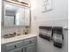Bright bathroom with modern fixtures, white tile, and a mirrored medicine cabinet at 7546 Lindenwood Dr, Indianapolis, IN 46227