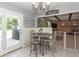Cozy breakfast nook with an eat-in table and easy access to the outdoor grill area at 7546 Lindenwood Dr, Indianapolis, IN 46227