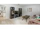 Cozy living room with neutral carpet, comfortable seating, and ample built-in storage at 7546 Lindenwood Dr, Indianapolis, IN 46227