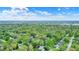 Community offering mature trees, well-maintained landscaping, and diverse homes set against a picturesque skyline backdrop at 7804 Wawasee Dr, Indianapolis, IN 46250