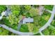 Property featuring a backyard deck, mature trees, landscaping, and a well-maintained lawn for outdoor enjoyment at 7804 Wawasee Dr, Indianapolis, IN 46250