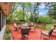 Exterior view of a beautiful, spacious deck with patio furniture and a grill at 7804 Wawasee Dr, Indianapolis, IN 46250