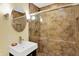 Renovated bathroom featuring tiled shower, modern vanity, and stylish fixtures creating a comfortable and modern space at 7804 Wawasee Dr, Indianapolis, IN 46250