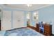 Relaxing bedroom with hardwood floors, a ceiling fan, closet, and ensuite bathroom at 7804 Wawasee Dr, Indianapolis, IN 46250