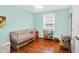 Bright bedroom with hardwood floors and natural light, ideal for a Bedroom or room at 7804 Wawasee Dr, Indianapolis, IN 46250
