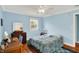 This cozy bedroom boasts hardwood floors, a ceiling fan, and lots of natural light at 7804 Wawasee Dr, Indianapolis, IN 46250