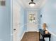 Inviting foyer with tile flooring, light blue walls, and white trim, creating a bright and welcoming entry at 7804 Wawasee Dr, Indianapolis, IN 46250