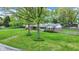 Lovely ranch home with a well-manicured lawn and mature trees offering shade and enhancing its appeal at 7804 Wawasee Dr, Indianapolis, IN 46250