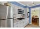 Kitchen featuring stainless steel appliances, white cabinets, and granite countertops at 7804 Wawasee Dr, Indianapolis, IN 46250