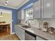 Kitchen area featuring stainless steel appliances, granite countertops and bright lighting at 7804 Wawasee Dr, Indianapolis, IN 46250