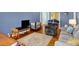 Cozy living room with hardwood floors, comfortable seating, and an entertainment area at 7804 Wawasee Dr, Indianapolis, IN 46250