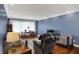 Inviting living room with hardwood floors, a dining table, and comfortable seating area at 7804 Wawasee Dr, Indianapolis, IN 46250