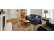 Inviting living room with a comfortable blue sofa, wood accents, and an area rug adding warmth at 7804 Wawasee Dr, Indianapolis, IN 46250