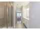 Modern bathroom with a glass-enclosed shower and a view into bedroom at 796 Sapp Cir, Westfield, IN 46074