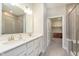 Bright bathroom with double vanity, tiled floors, and glass shower at 796 Sapp Cir, Westfield, IN 46074