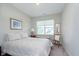 Cozy bedroom with natural light, complemented by a quaint chair and soft, patterned bedding at 796 Sapp Cir, Westfield, IN 46074