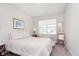 Cozy bedroom with a large window, a comfortable bed, and carpeted floors at 796 Sapp Cir, Westfield, IN 46074