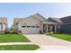 Attractive single-story home with a two-car garage, covered porch, and well-maintained landscaping at 796 Sapp Cir, Westfield, IN 46074