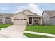 Charming single-story home featuring a well-manicured lawn, a covered porch, and an attached two-car garage at 796 Sapp Cir, Westfield, IN 46074