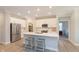 Modern kitchen featuring a large island with seating, stainless steel appliances, and white cabinetry for a clean look at 796 Sapp Cir, Westfield, IN 46074