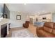 Open-concept living area with a fireplace and a view into the modern kitchen, perfect for entertaining guests at 796 Sapp Cir, Westfield, IN 46074