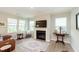 Cozy living room with a fireplace, large windows, and comfortable seating, creating an inviting atmosphere at 796 Sapp Cir, Westfield, IN 46074