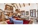 Expansive living area featuring a fireplace, access to the kitchen, and an adjoining staircase at 8103 N Pennsylvania St, Indianapolis, IN 46240