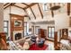 Inviting living room with beamed ceiling, fireplace, and an abundance of natural light at 8103 N Pennsylvania St, Indianapolis, IN 46240