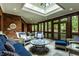 Bright sunroom with skylights, brick accents, and cozy seating at 8103 N Pennsylvania St, Indianapolis, IN 46240