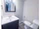 Well-lit bathroom with modern vanity, updated mirror, and a clean, functional layout at 8350 Paso Del Norte Ct, Indianapolis, IN 46227