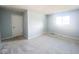 Comfortable bedroom featuring neutral carpet, freshly painted walls, and a sunny window at 8350 Paso Del Norte Ct, Indianapolis, IN 46227