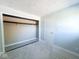 Bedroom with neutral carpet, ample sunlight, and an open closet space for convenience at 8350 Paso Del Norte Ct, Indianapolis, IN 46227
