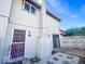 Two-story home exterior with a metal door grate, chimney, and blue sky at 8350 Paso Del Norte Ct, Indianapolis, IN 46227