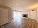 Open-concept living room features laminate floors, a fireplace, and natural light at 8350 Paso Del Norte Ct, Indianapolis, IN 46227
