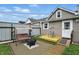 Cozy backyard patio featuring a swing, fire pit, and a small deck, great for outdoor relaxation at 842 Miller Ave, Shelbyville, IN 46176